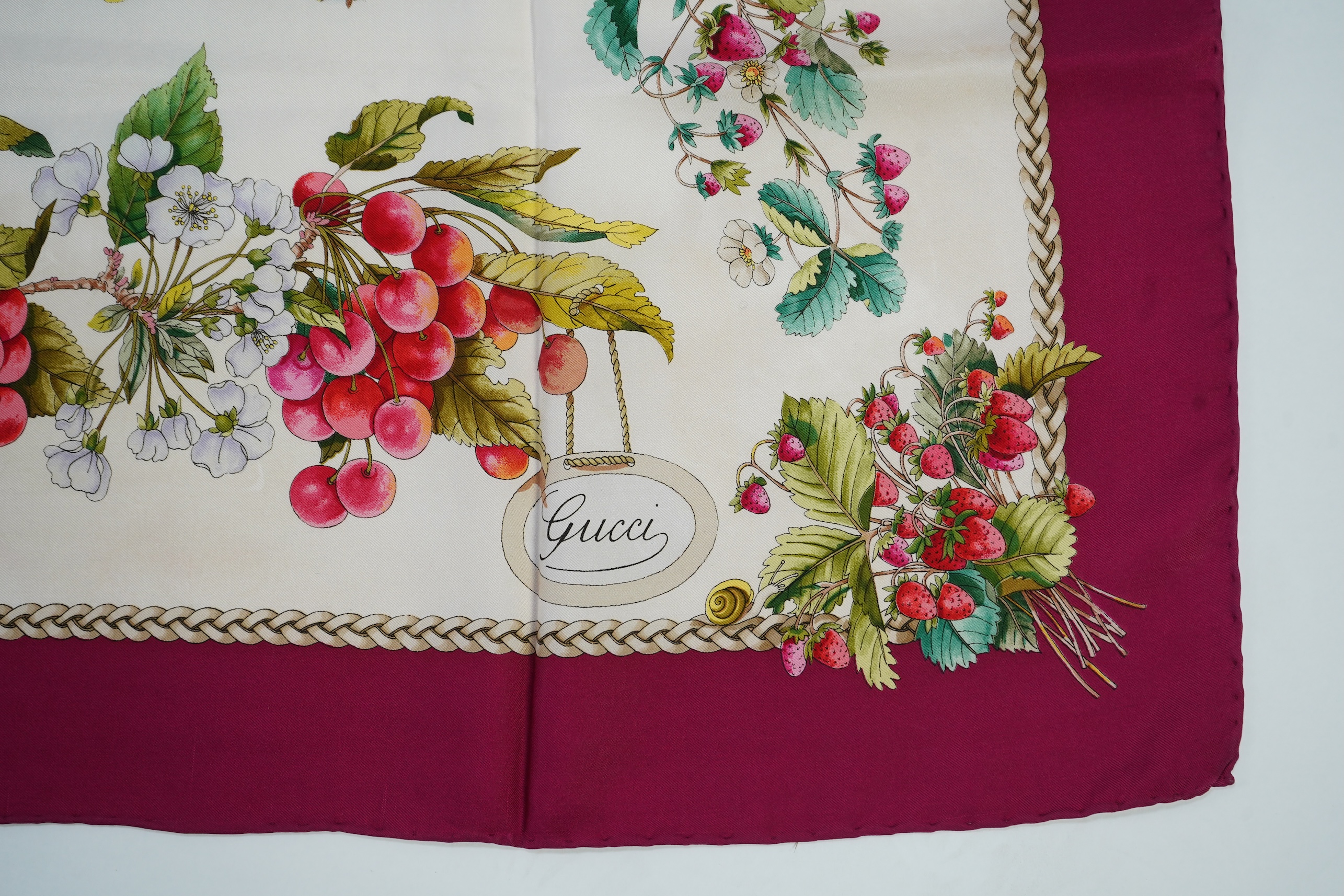 A vintage Gucci silk scarf with a design of strawberries and cherries, 86 x 87cm